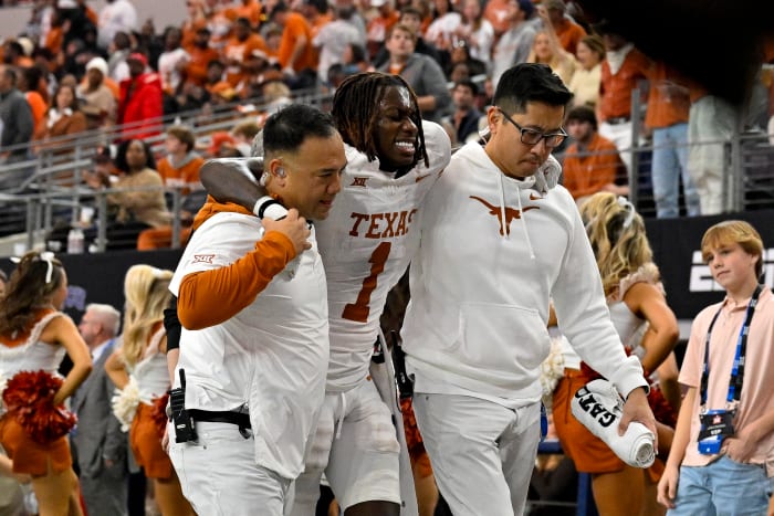 Texas Longhorns Xavier Worthy being helped to the locker room at AT&T Stadium